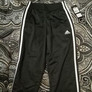 NWT Adidas little boys track pants black with white stripes, size 7X